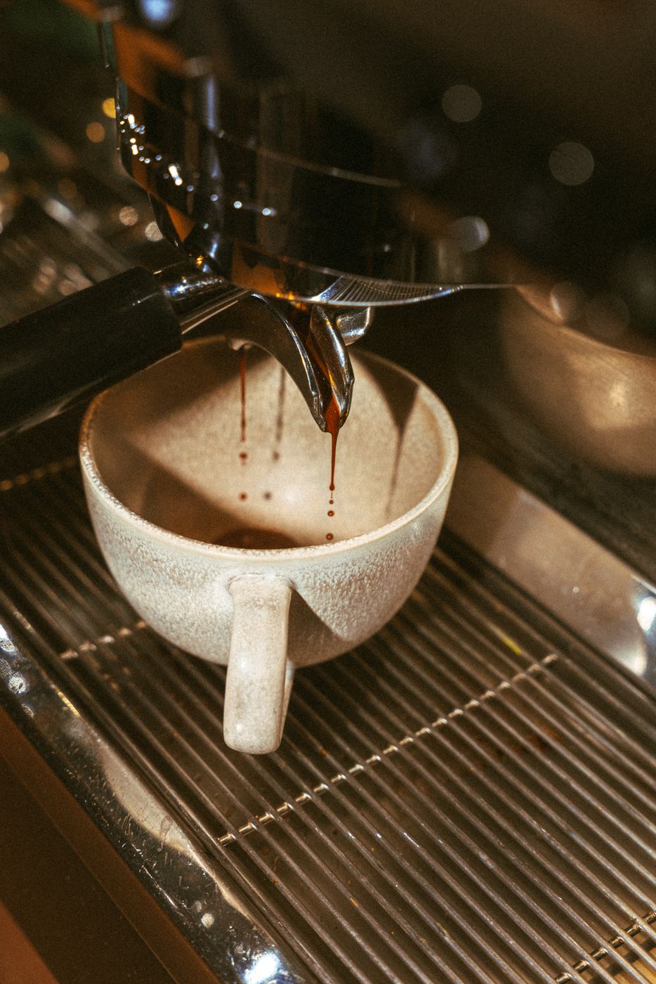 Espresso running into a stone cup