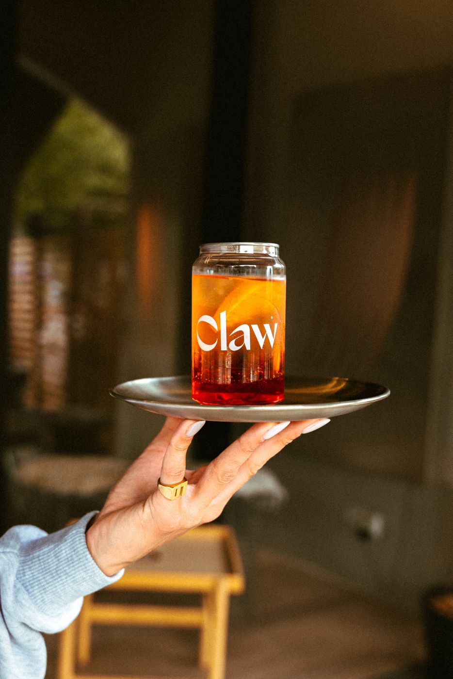 Homemade ice tea in a Claw jar on a tray