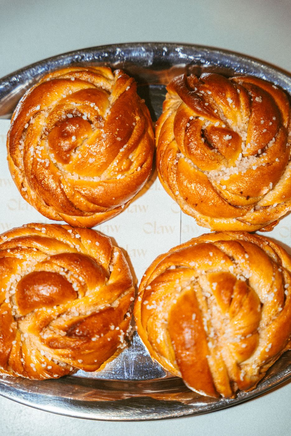 Cinnamon buns on a silver tray